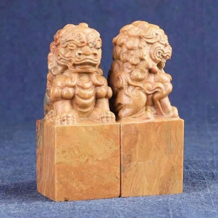 Pair of stone seals with guardian lion handles